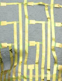 Neural electrode array wrapped onto a model of the brain.