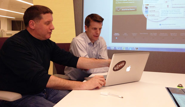 Scott DeFusco (L) Reviews Data With Kona Cofounder Jeff Eckerle